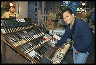Jin shopping for knives at the Tsukiji Market. Tokyo
