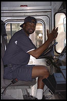 Courier stuck in traffic jam.  Washington, D.C.  In 1995, Bill Clinton closed Pennsylvania Avenue to traffic by commoners.  Hence residents of Washington, D.C. are forced to fight their way through traffic to get around the White House.