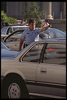 Traffic cop trying to untangle the perpetual traffic jam created in Washington, D.C.  by Bill Clinton's closure of Pennsylvania Avenue to traffic by commoners.