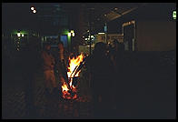Staying warm around the fire, outside the Fulton Fish Market.  Manhattan 1994 (pre burning).