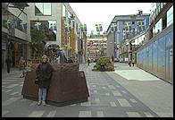 A street for pedestrians in central Stockholm with an anti-violence gun statue (with Eve Andersson in front)