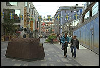 A street for pedestrians in central Stockholm with an anti-violence gun statue