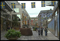 A street for pedestrians in central Stockholm with an anti-violence gun statue