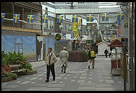 A street for pedestrians in central Stockholm with an anti-violence gun statue