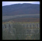 A distance view of the ruined abbey of San Galgano, between Rome and Florence