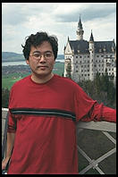 Jin in front of Neuschwanstein from Marienbruecke.