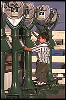 Kid and Telescopes.  Monterey, California.