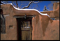 Adboe house and snow.  Santa Fe, New Mexico