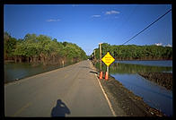 A sign warning of water over the road near St. Charles, Missouri.  This was 1993, the year of the Great Mississippi Flood.