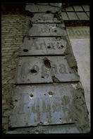 A wall in East Berlin circa 1993 still bears the scars of the Red Army