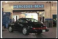 Porsche 911 with minor scratch in rear bumper paint