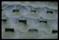 Cooling water flowing out of the Vermont Yankee nuclear power plant and back into the Connecticut River.  These concrete structures are designed to aerate the water and make it more useful to the life of the river.  Vernon, Vermont.