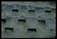 Cooling water flowing out of the Vermont Yankee nuclear power plant and back into the Connecticut River.  These concrete structures are designed to aerate the water and make it more useful to the life of the river.  Vernon, Vermont.