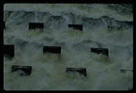 Cooling water flowing out of the Vermont Yankee nuclear power plant and back into the Connecticut River.  These concrete structures are designed to aerate the water and make it more useful to the life of the river.  Vernon, Vermont.