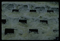 Cooling water flowing out of the Vermont Yankee nuclear power plant and back into the Connecticut River.  These concrete structures are designed to aerate the water and make it more useful to the life of the river.  Vernon, Vermont.