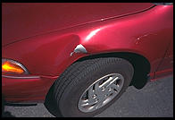Dented rental car in Berkeley, California.  They did not leave a note.